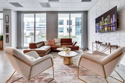 a living room with a couch and chairs and a table at Modern 2/2 with Beautiful Ocean and Brickell Views in Miami