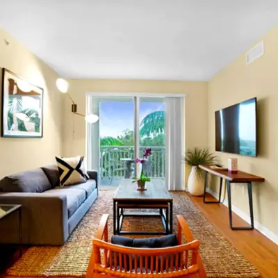 a living room with a couch and a table at Beautiful Apartment with Pool in Miami in Miami