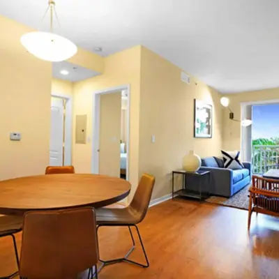 a living room with a table and a couch at Beautiful Apartment with Pool in Miami in Miami
