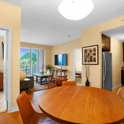 a kitchen and living room with a table and chairs at Beautiful Apartment with Pool in Miami in Miami
