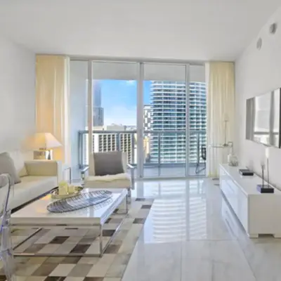 a living room with a couch and a table at Vacation Apartment for Couples in Miami in Miami