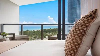 a hotel room with a bed and a large window at Ocean View Private Residence at South Beach - 804 in Miami Beach