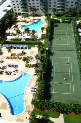 an overhead view of two tennis courts in a resort at Ocean Reserve 222 STR-2158 in Miami Beach