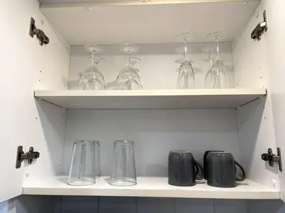 a shelf with wine glasses and other items on it at Ocean Reserve 222 STR-2158 in Miami Beach