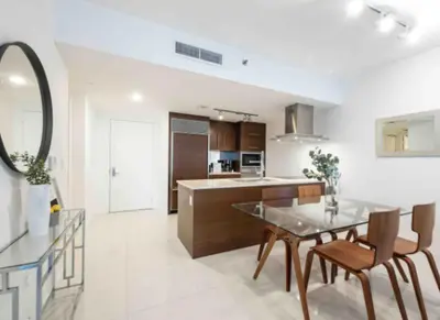 a kitchen and dining room with a table and chairs at Vacation Apartment in Miami in Miami