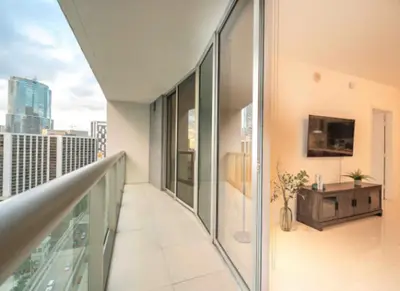 an apartment balcony with a view of the city at Vacation Apartment in Miami in Miami