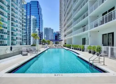 a swimming pool in the middle of a building at Modern Vacation Apartment in Miami in Miami