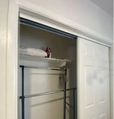 a closet with a white door and a shelf at Small House Near Airport Beach - Wynwood in Miami