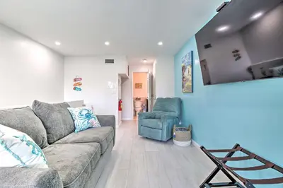 a living room with a couch and a chair at Canal-Front Condo Walk to Downtown Ft Lauderdale! in Fort Lauderdale