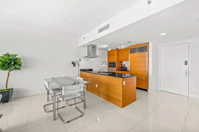 a kitchen with a counter and a table in it at Gorgeous Unit At The W Building Priceless Location in Miami