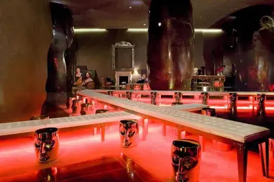 a row of tables in a room with red lights at Gorgeous Unit At The W Building Priceless Location in Miami