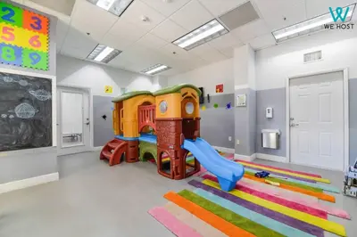 a childs play room with a slide and a playground at Wonderful Condo in Brickell With Pool and Gym in Miami