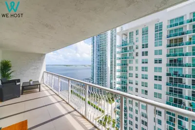 a balcony with a view of a tall building at Wonderful Condo in Brickell With Pool and Gym in Miami