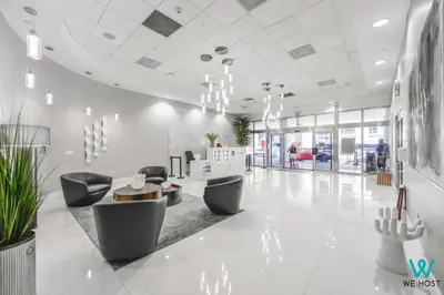 a lobby with chairs and a table in a building at Wonderful Condo in Brickell With Pool and Gym in Miami