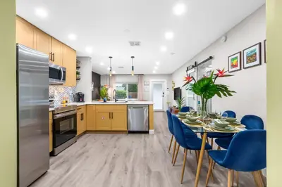 a kitchen and dining room with a table and chairs at Swim, Dine, and Relax - Your private paradise awaits in Fort Lauderdale