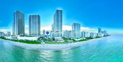 a view of a beach with tall buildings and the ocean at Hollywood Beach Ocean View Condo, Direct Beach Access, Pool & Resort Amenities in Hollywood