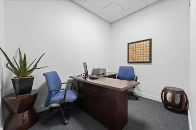 an office with two blue chairs and a desk with a computer at Hollywood Beach Ocean View Condo, Direct Beach Access, Pool & Resort Amenities in Hollywood