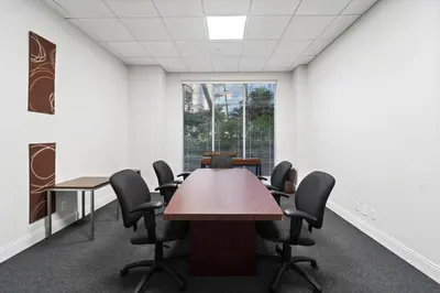 a conference room with a table and chairs at Hollywood Beach Ocean View Condo, Direct Beach Access, Pool & Resort Amenities in Hollywood