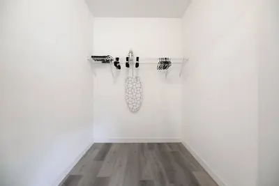 a room with a white wall and a glass shelf at Amazing Townhouse 15 minutes from the Beach in Miami