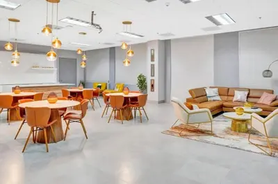 a living room with tables and couches and chairs at Condo in Brickell Business District in Miami