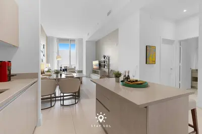 a kitchen with a large island in a room at Beachfront Condo - Amazing Pool - Oceanview Balcony in Hollywood