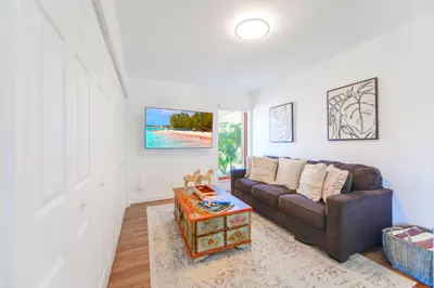 a living room with a couch and a table at Family-Friendly 4BR House with Pool in Westchester Miami in Tamiami