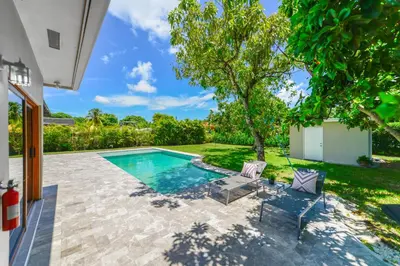 an image of a swimming pool in a house at Family-Friendly 4BR House with Pool in Westchester Miami in Tamiami