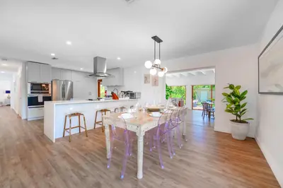 a dining room and kitchen with a table and chairs at Family-Friendly 4BR House with Pool in Westchester Miami in Tamiami
