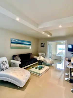 a living room with a couch and a glass table at Premium Modern waterfront apartment with Miami Skyline view on the bay 5 mins drive to Miami Beach with free parking in Miami Beach