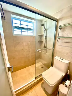 a bathroom with a glass shower and a toilet at Premium Modern waterfront apartment with Miami Skyline view on the bay 5 mins drive to Miami Beach with free parking in Miami Beach