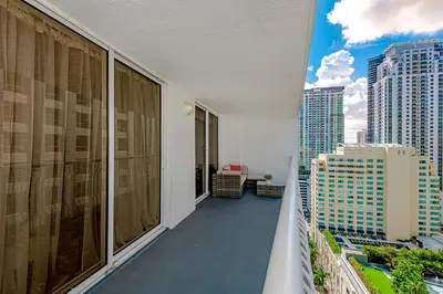 a balcony with a view of a city at Lovely condo with city & ocean views. Sleep up to 6 people! in Miami