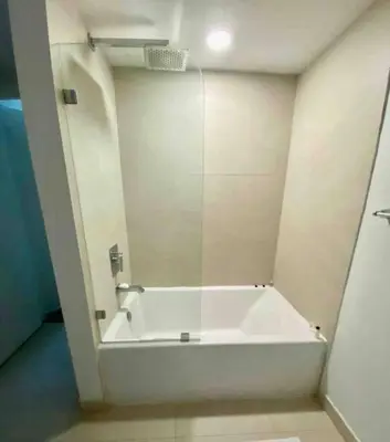 a white bath tub in a bathroom with a mirror at Ocean View Beachfront 2Bed/2B M-Penthouse @HYDE in Hollywood