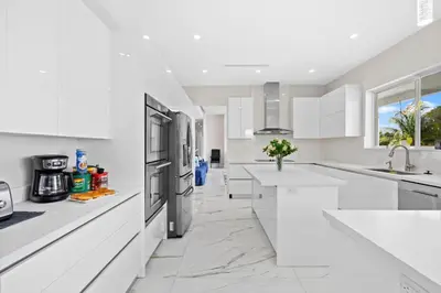 a white kitchen with white counters and appliances at Casa Blanca of Miami º Families & Weekly Stays Close to Miami Beaches and the Keys West in Princeton