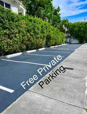 a parking lot with a sign that reads emergency parking at The Oasis in Miami
