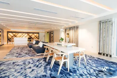 a living room with a table and a couch at 1 Bedroom with ocean and city views! in Fort Lauderdale