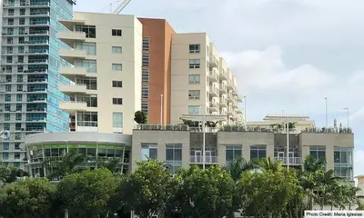 a group of tall buildings in a city at Wonderful 1 bedroom condo in Midtown. in Miami