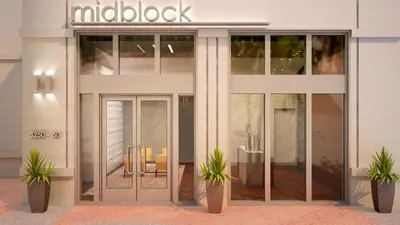 a glass door of a building with a table and chairs at Wonderful 1 bedroom condo in Midtown. in Miami