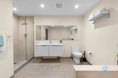 a bathroom with a toilet and a sink and a shower at Perfect Relax - Rooftop Pool - Gym - Hot Tub in Hollywood