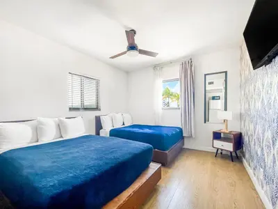 a bedroom with two beds and a ceiling fan at The Delmar in Hollywood