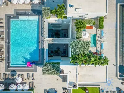 an overhead view of a building with a swimming pool at Exclusive Apartment - Rooftop Pool - Hollywood Beach in Hollywood