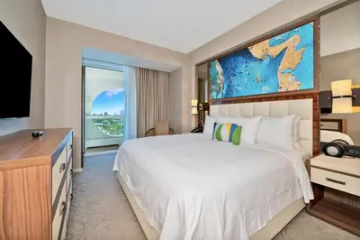 a bedroom with a large bed and a television at Stylish 1 BR at Fort Lauderdale in Fort Lauderdale