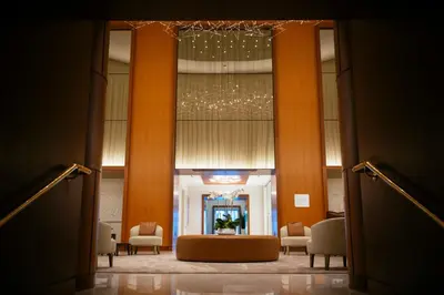 a view of a lobby with chairs and a chandelier at Stylish 1 BR at Fort Lauderdale in Fort Lauderdale
