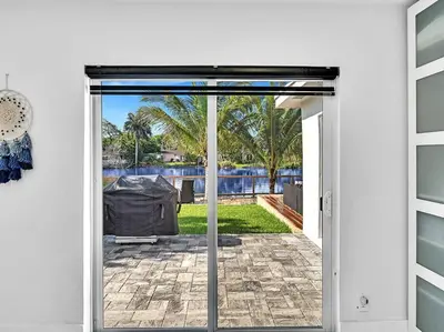 an open door with a view of a patio at 5-star Lakefront Oasis In Hollywood-Hard rock casino in Fort Lauderdale