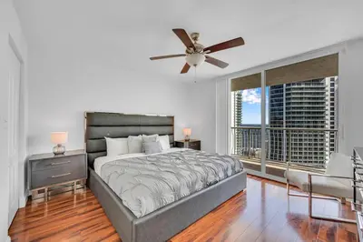 a bedroom with a bed and a ceiling fan at 40th floor Ocean View - Best Location in Miami