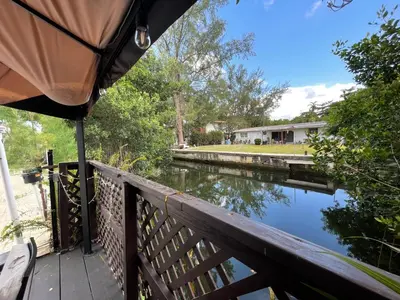 a view of a river from the deck of a house at Pool House on the Water 2 in Miami
