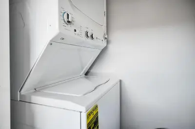 a white refrigerator with its door open and a box at Vacay Spot Happy Escape 15 Min Beach Massage Shower Prime LOC! 6 blocks away from Bars, Nite Clubs, Res, Shops in Miami