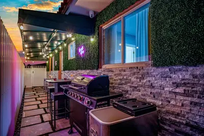 a kitchen with a stove and some chairs in it at Vacay Spot Happy Escape 15 Min Beach Massage Shower Prime LOC! 6 blocks away from Bars, Nite Clubs, Res, Shops in Miami