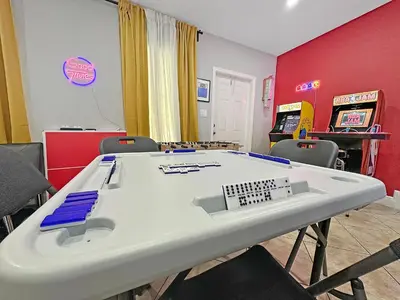 a room with a table with a keyboard on it at Vacay Spot Gables 4 to 23 Guest GameRoom 2 Kitchens 2 BBQ, 2 BAR, Backyard, Patio, Prime LOC! 6 blocks away from Bars, Nite Clubs, Res, Shops in Miami