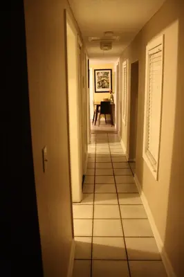 a hallway of a house with a tile floor at Key West Style Historic Home in Coconut Grove Florida The Yellow House in Miami