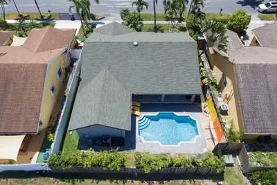 an overhead view of a house with a swimming pool at Citrus+Sunshine/Heated Pool/6 min to Beach/Casino in Dania Beach